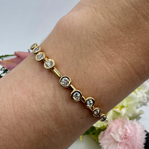 Hidden Hinge Scattered Bezel Diamond Bracelet in Yellow Gold