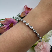 Hidden Hinge Scattered Bezel Diamond Bracelet in White Gold