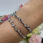 Hidden Hinge Scattered Bezel Diamond Bracelet in White Gold